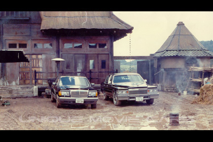 Benz and Cadillac on set