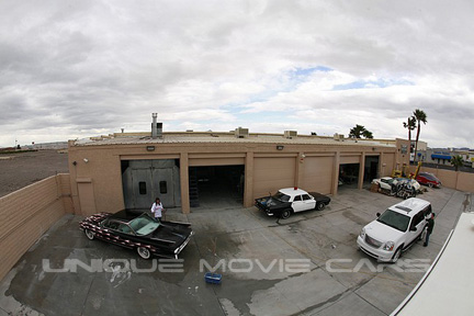 Custom Hot Rod and Police Car in b.g.